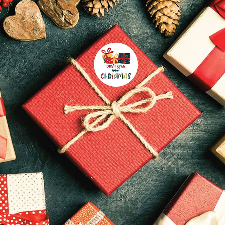 Do Not Open Until Christmas sticker on gift wrapping