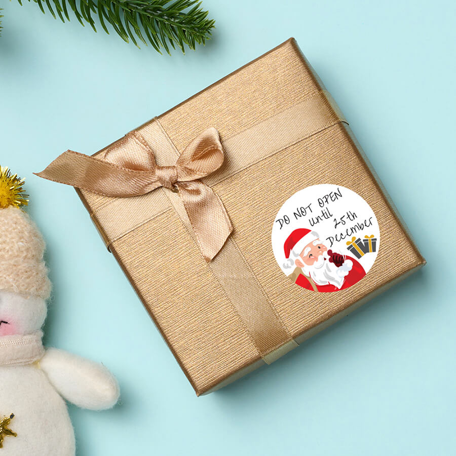 Do Not Open Until Christmas sticker applied to a present